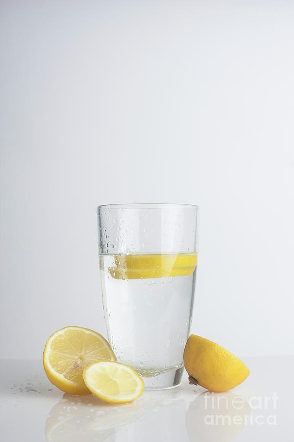 A Glass Of Water With Fresh Lemon Slices Photograph by Cristina Pedrazzini/science Photo Library