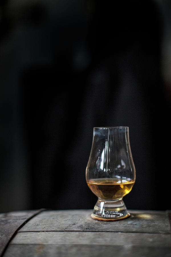A Glass Of Whisky On A Wooden Barrel Photograph by Helen Cathcart