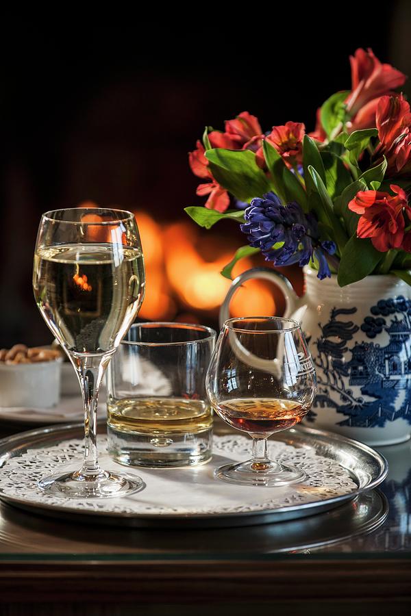 A Glass Of White Wine, A Whiskey And Cognac On A Tray Photograph by Brian Harrison