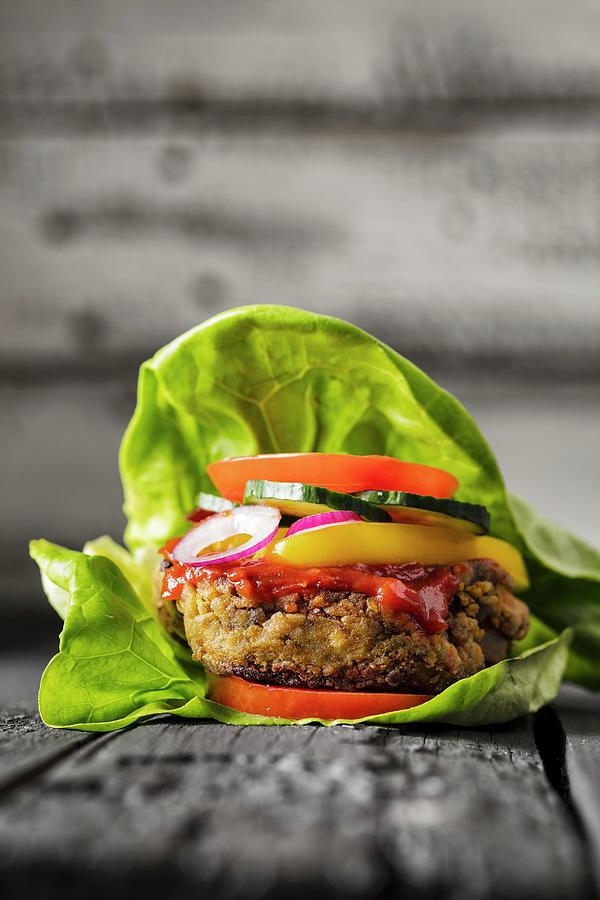 A Gluten-free Veggie Burger In A Lettuce Leaf Photograph by Jan Prerovsky