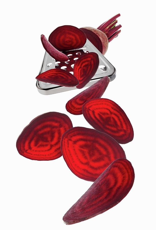 A Grater With A Beetroot And Beetroot Slices Photograph by Krger & Gross