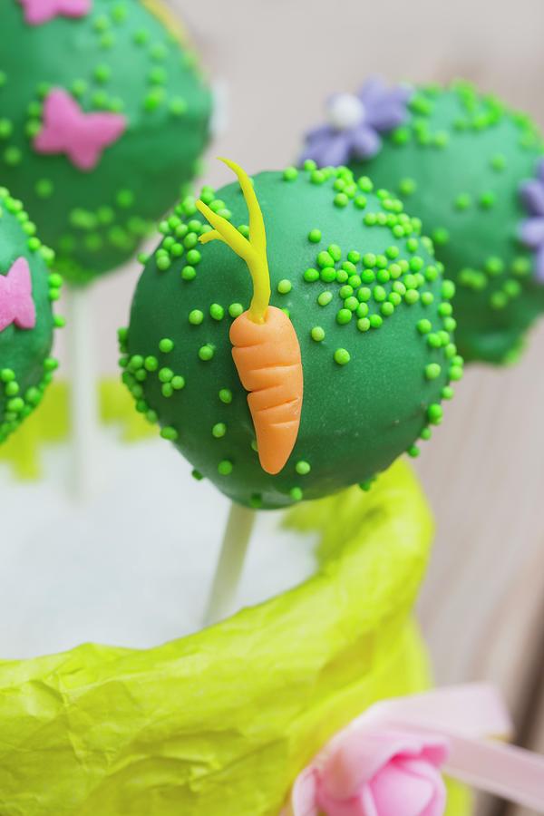 A Green Cake Pop Decorated With A Carrot Photograph by Esther Hildebrandt
