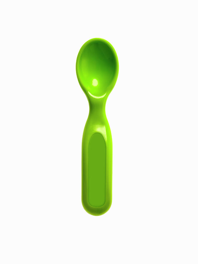 A Green Plastic Baby Spoon Photograph by Mint Images - David Arky
