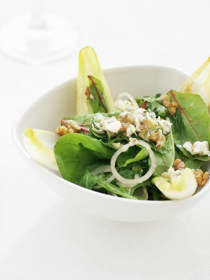 A Green Salad With Nuts, Onions And Dressing Photograph by Martin Dyrlv