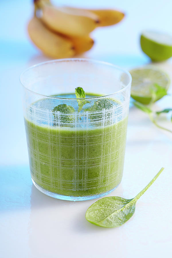 A Green Smoothie Made With Banana, Apple, Spinach, Cucumber, Ginger, Lime And Coconut Milk Photograph by Teubner Foodfoto