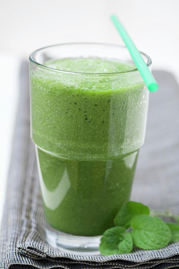 A Green Smoothie Made With Spinach, Lambs Lettuce, Apple, Banana And Apple Mint Photograph by Brantley, Anita