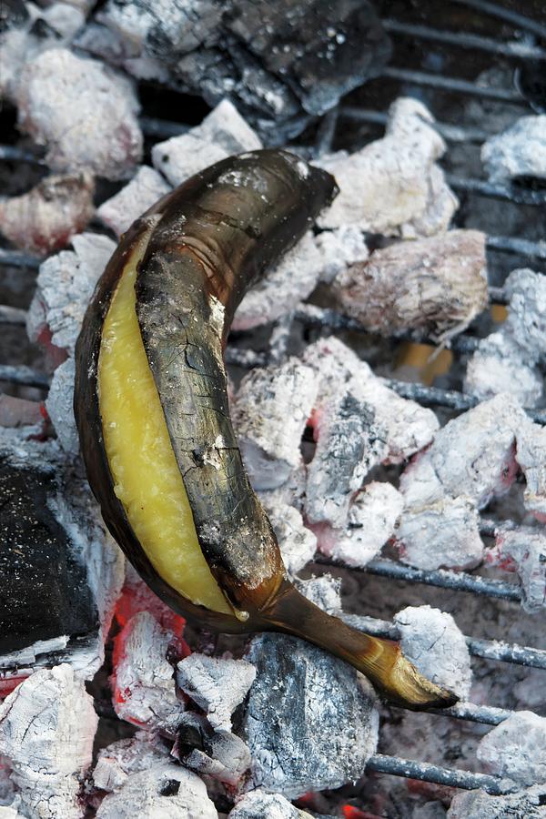 A Grilled Plantain On Hot Coals Photograph by Petr Gross