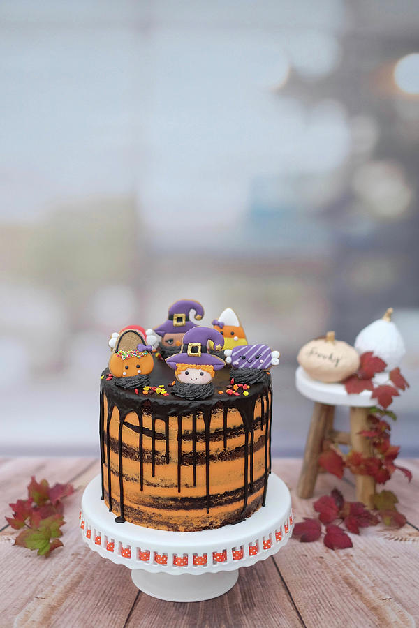 A Halloween Drip Cake With Royal Icing Biscuits made With Guinness, Chocolate And Blood Orange Photograph by Marions Kaffeeklatsch
