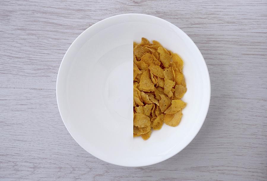 A Halved Portion Of Cornflakes In A White Bowl view From Above Photograph by Pendle, Carl