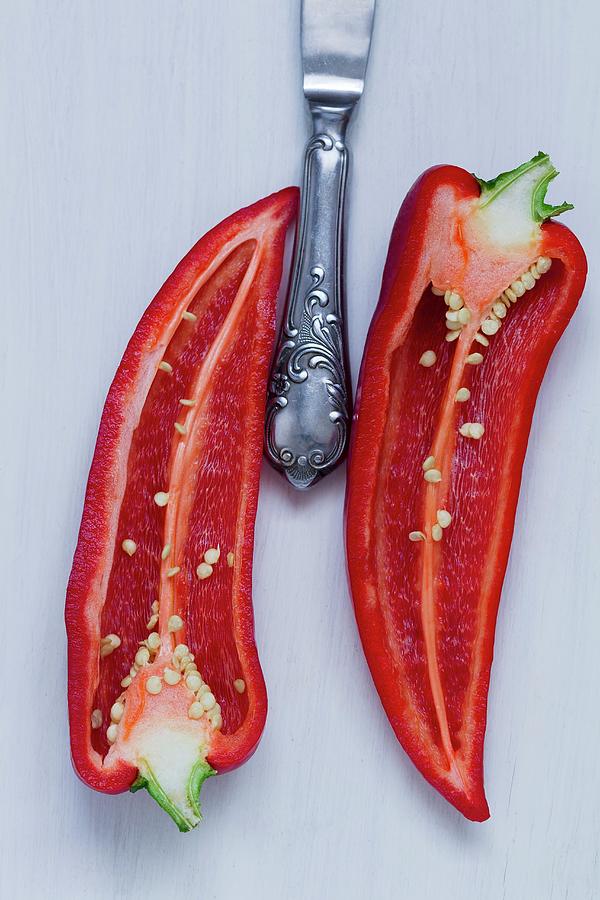 A Halved Red Chilli Pepper Photograph by Adel Bekefi
