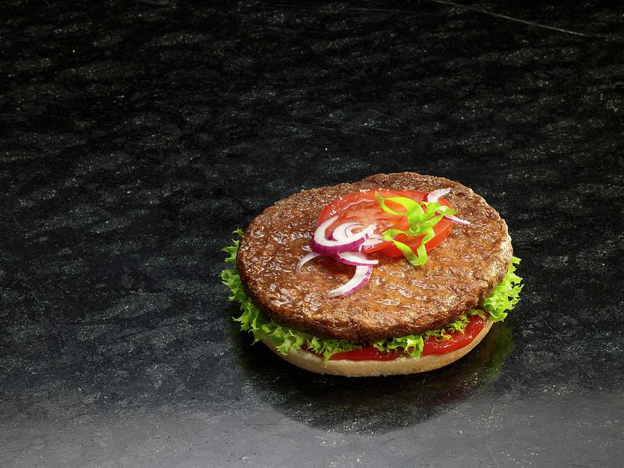 A Hamburger On A Halved Burger Bun Photograph by Nikolai Buroh