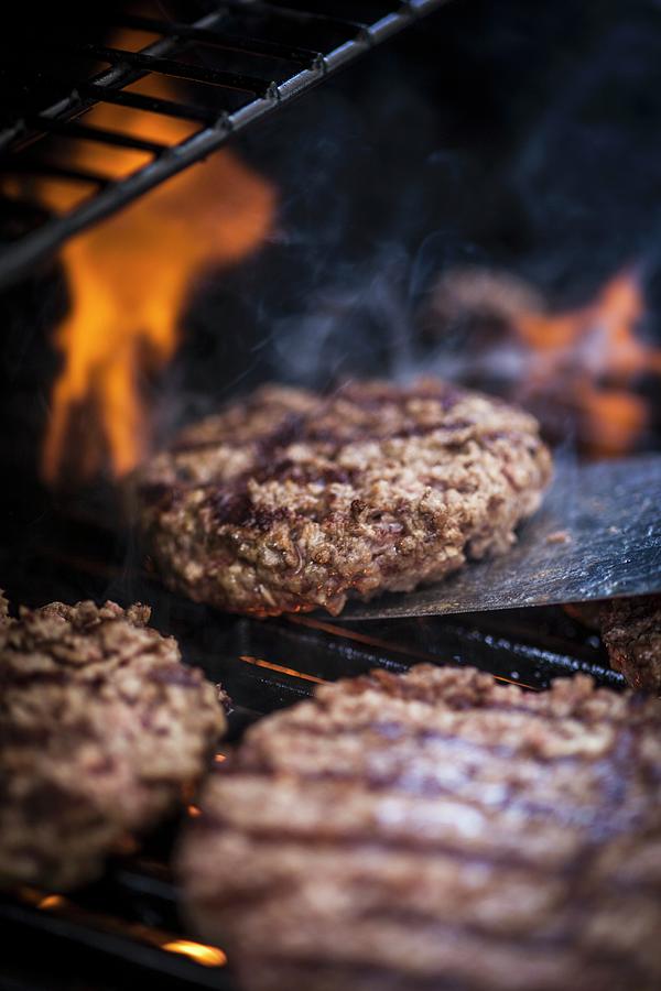 A Hamburger On The Grill Photograph by Eising Studio