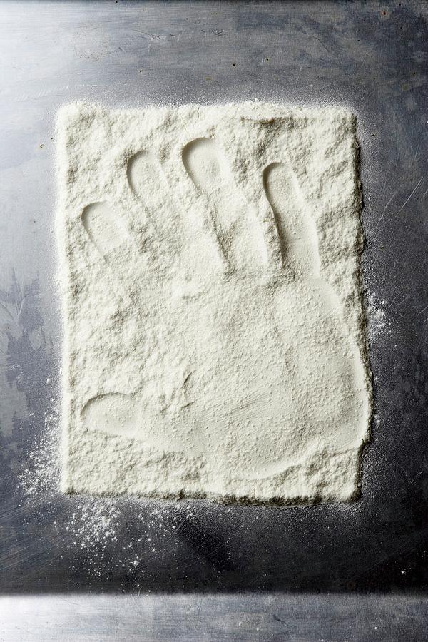 A Hand Print In Flour seen From Above Photograph by Till Melchior