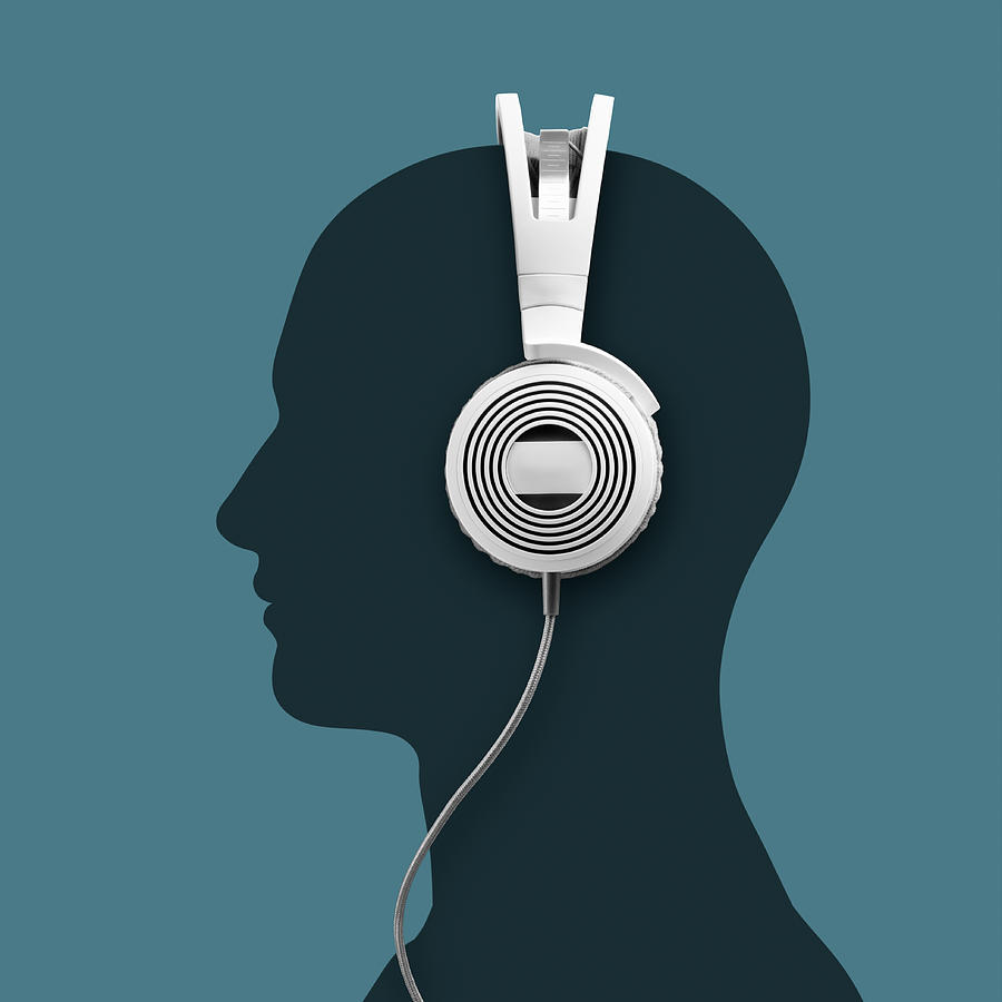 A Headphone And A Silhouette Head Photograph by Jorg Greuel
