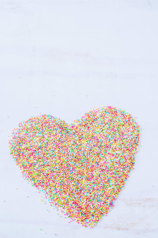 A Heart Shape Made With Colorful Sprinkles On A White Surface Photograph by Maricruz Avalos Flores