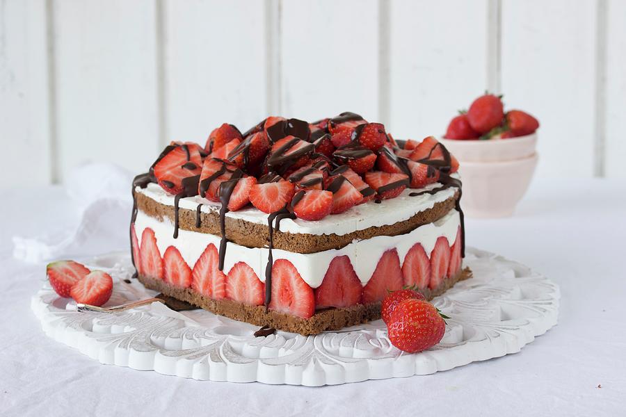 A Heart Shaped Chocolate And Strawberry Cake With Cream Photograph by Emma Friedrichs