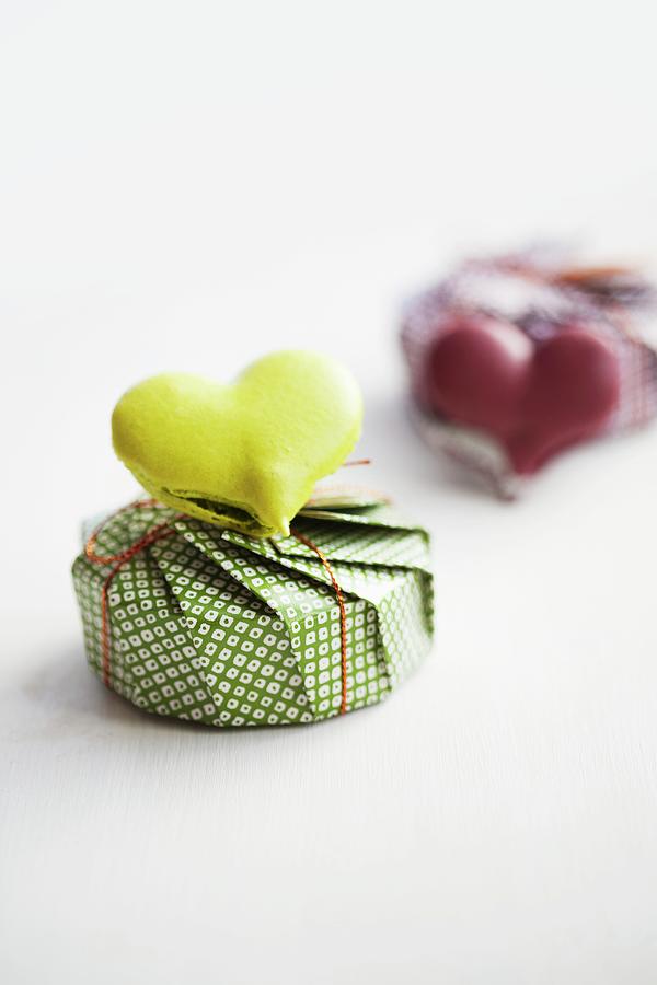 A Heart-shaped Lime Macaroon On Top Of A Present Photograph by Schindler, Martina