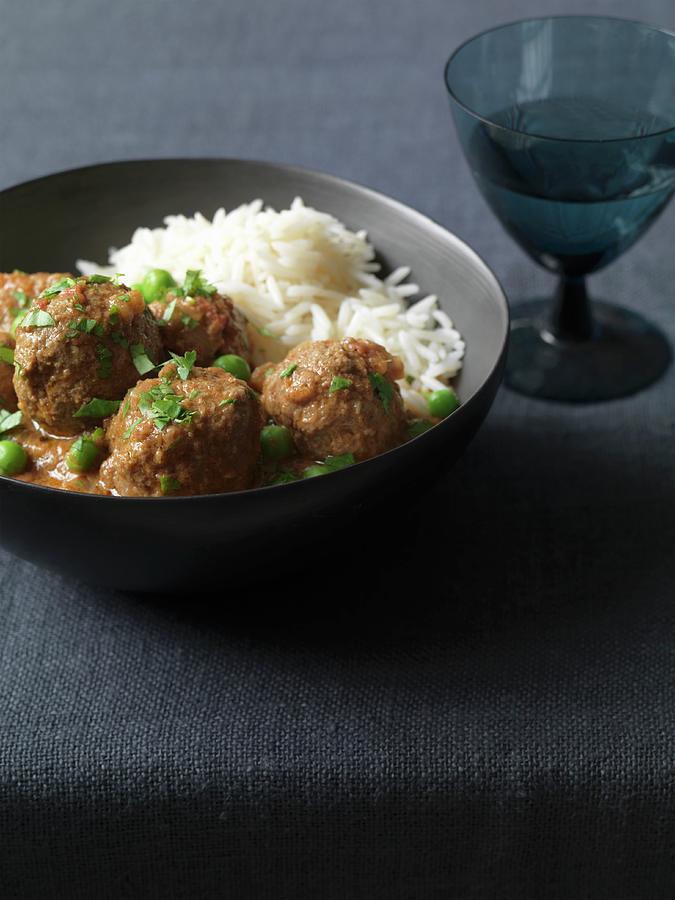 A Hearty Lamb Meatball Curry With Peas And Rice india Photograph by ...