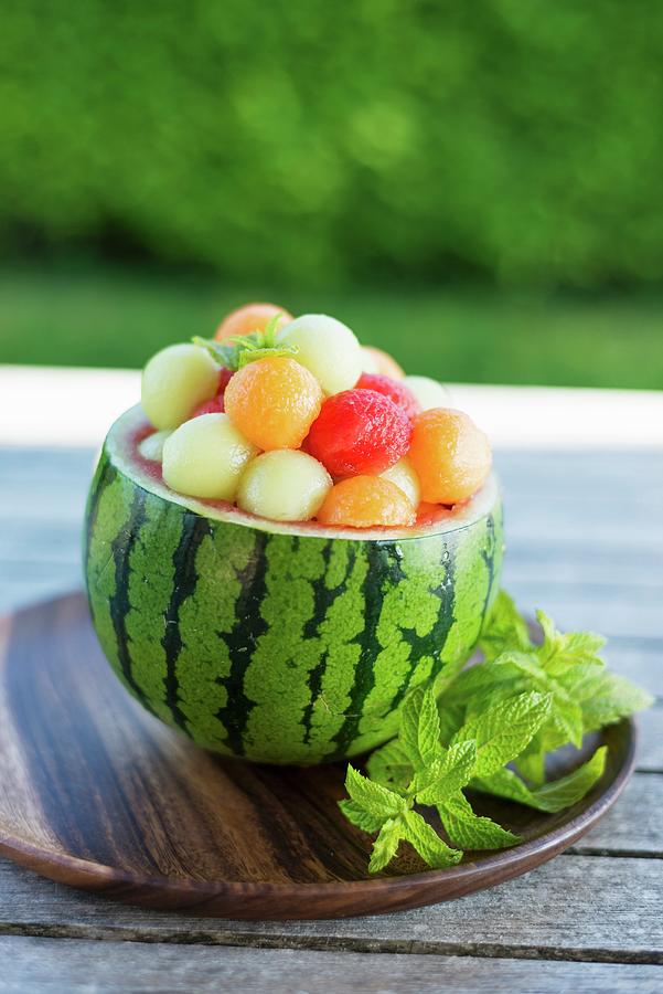A Hollowed Out Watermelon Filled With Various Different Melon Balls Photograph by Sonia Chatelain