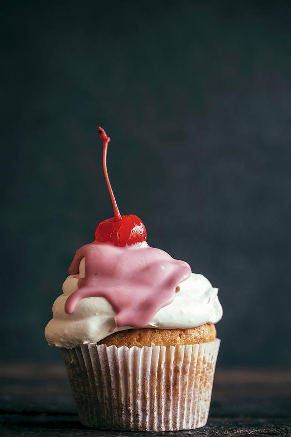 A Homemade Cupcake Topped With A Cocktail Cherry Photograph by Ltummy