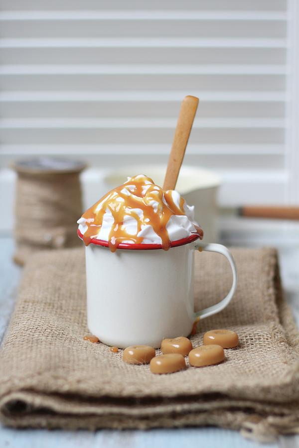 A Hot Caramel Drink Topped With Cream Photograph by Sylvia E.k Photography