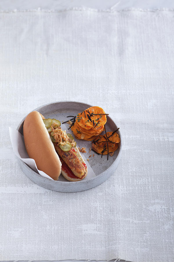 A Hot Dog With An Algae Sausage With Sweet Potato Crisps Photograph by Eising Studio