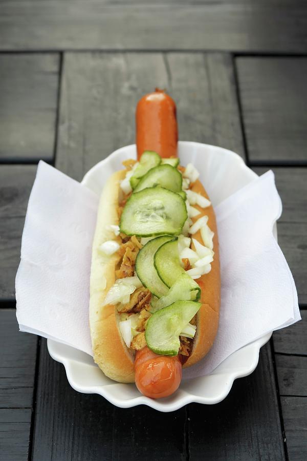 A Hot Dog With Gherkins And Roasted Onions Photograph by Petr Gross