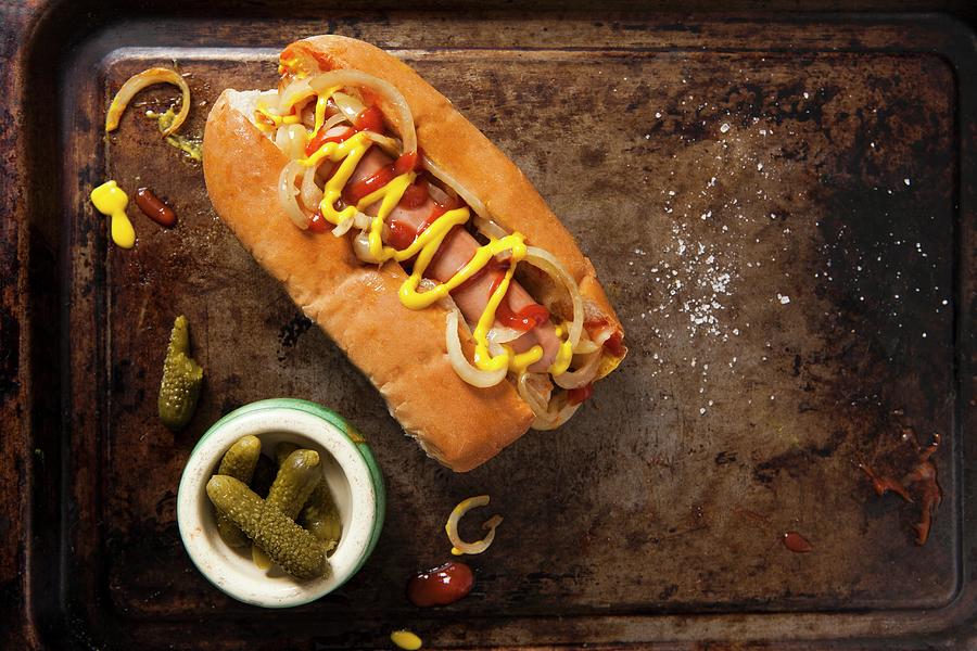 A Hot Dog With Ketchup, Mustard And Fried Onions Served On A Vintage Baking Tray Photograph by Stacy Grant