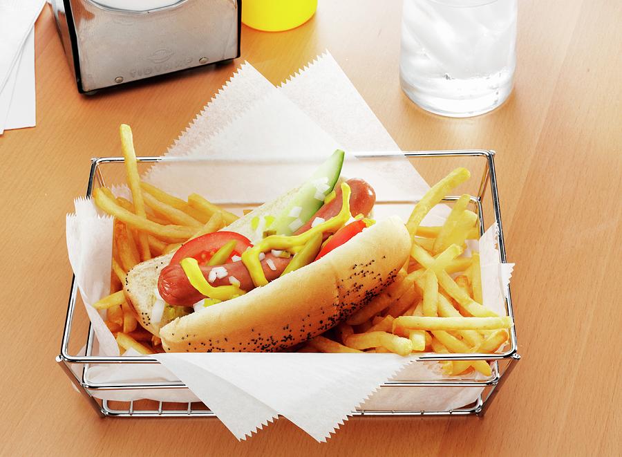 Bread Photograph - A Hot Dog With The Works And French Fries In A Metal Basket by Albert P Macdonald