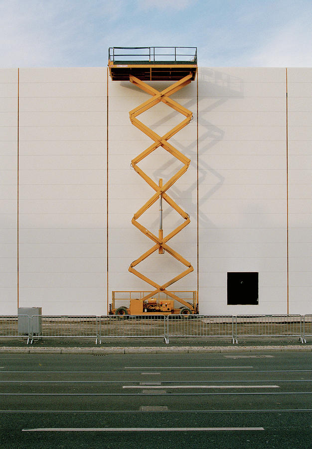 A Hydraulic Platform Raised Next To A Photograph by Martin Diebel