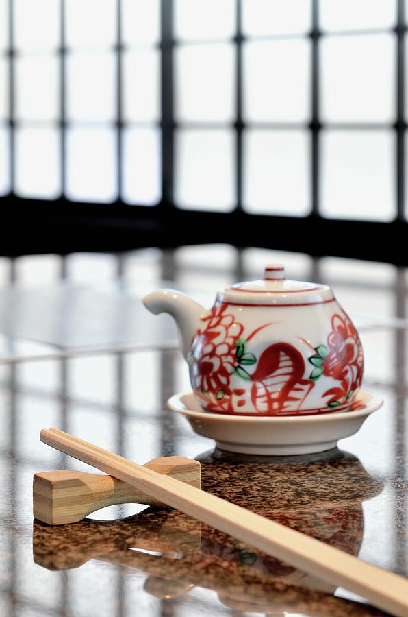 A Japanese Table Set With Chopsticks And A Sake Pot Photograph by Foto4food