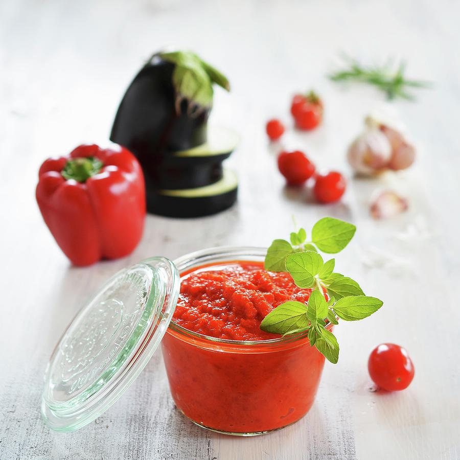 A Jar Of Ajvar And Fresh Ingredients In The Background Photograph by Mariola Streim