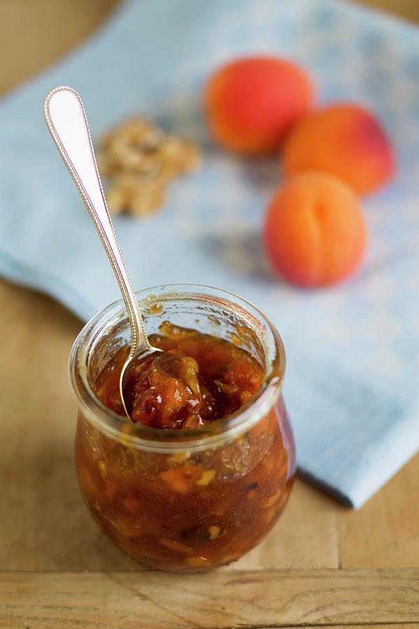 A Jar Of Apricot And Nectarine Jam With Walnuts Photograph by Claudia Timmann