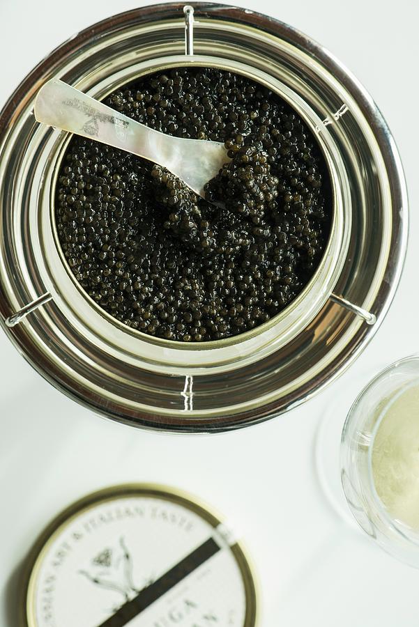 A Jar Of Black Caviar With A Mother-of-pearl Spoon Photograph by Jalag ...