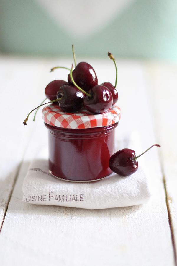 A Jar Of Cherry Jam And Fresh Cherries Photograph by Sylvia E.k Photography