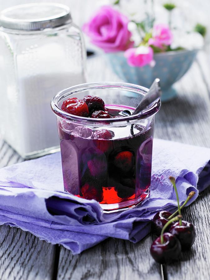 A Jar Of Cherry Jelly Photograph by Mikkel Adsbl