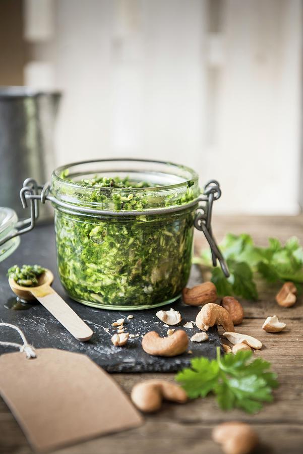 A Jar Of Coriander And Cashew Nut Pesto Photograph by Magdalena Hendey