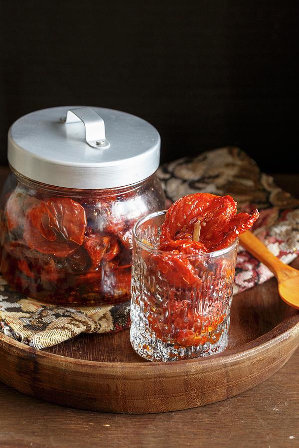 A Jar Of Dried Tomatoes Photograph by Sandhya Hariharan