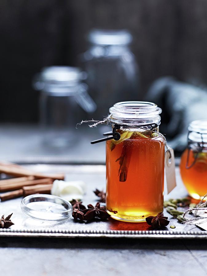 A Jar Of Honey With Spices Photograph by Oliver Brachat