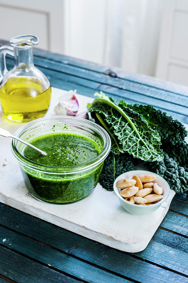 A Jar With Vegan Kale Pesto Made With Almonds, Garlic And Olive Oil Photograph by Maricruz Avalos Flores