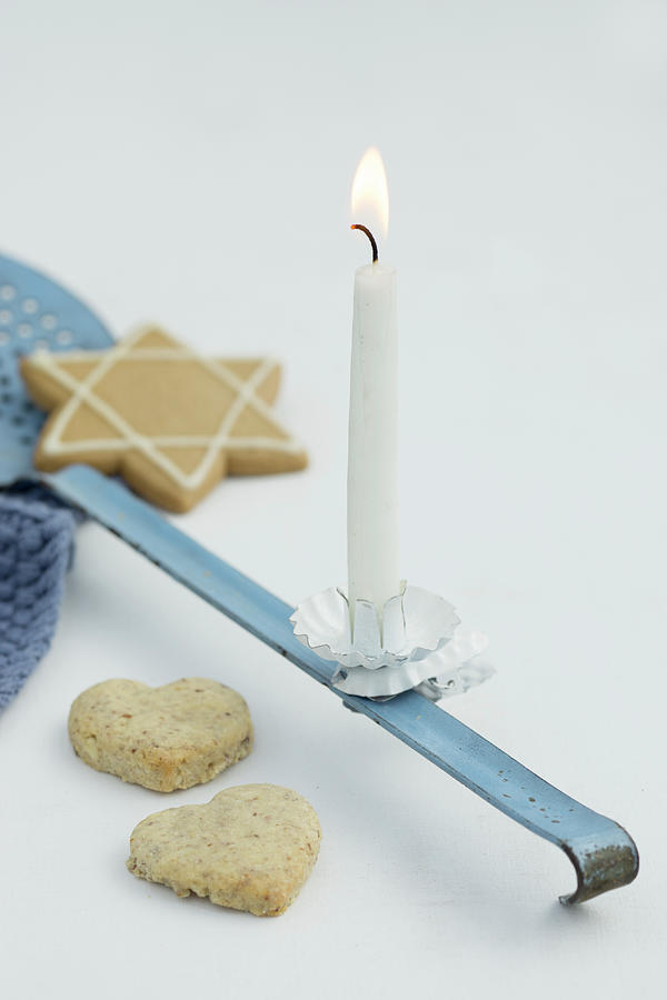 A Ladle With A Candle And Cookies Photograph by Martina Schindler
