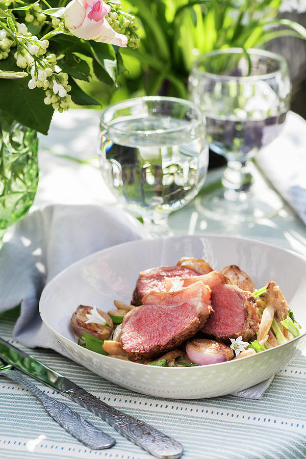 A Lamb Dish On A Summery Table In The Open Air Photograph by Winfried Heinze