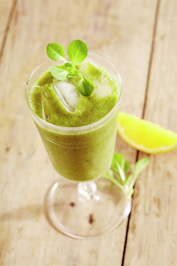 A Lambs Lettuce And Fruit Smoothie Photograph by Teubner Foodfoto