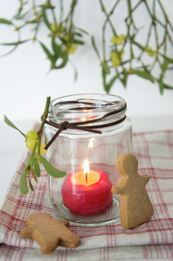 A Lantern With A Burning Candle, Spiced Biscuits And Mistletoe Photograph by Martina Schindler
