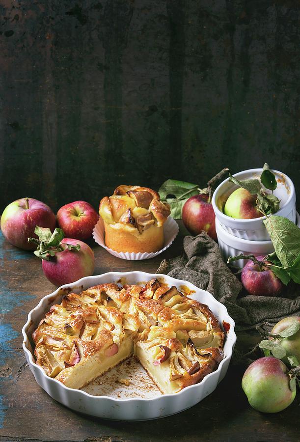 A Large And A Small Apple And Cottage Cheese Cake With Fresh Apples On A Dark Wooden Surface Photograph by Natasha Breen