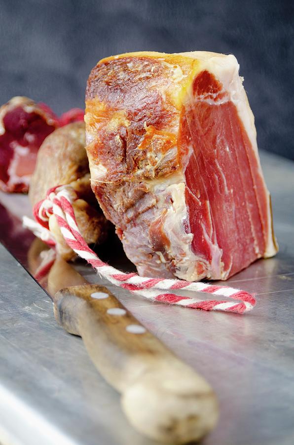 A Large Piece Of Spanish Serrano Ham Photograph by Watson, Jamie
