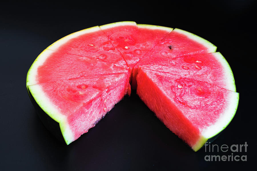 A large slice of watermelon divided into smaller pieces, flat, r Photograph by Joaquin Corbalan