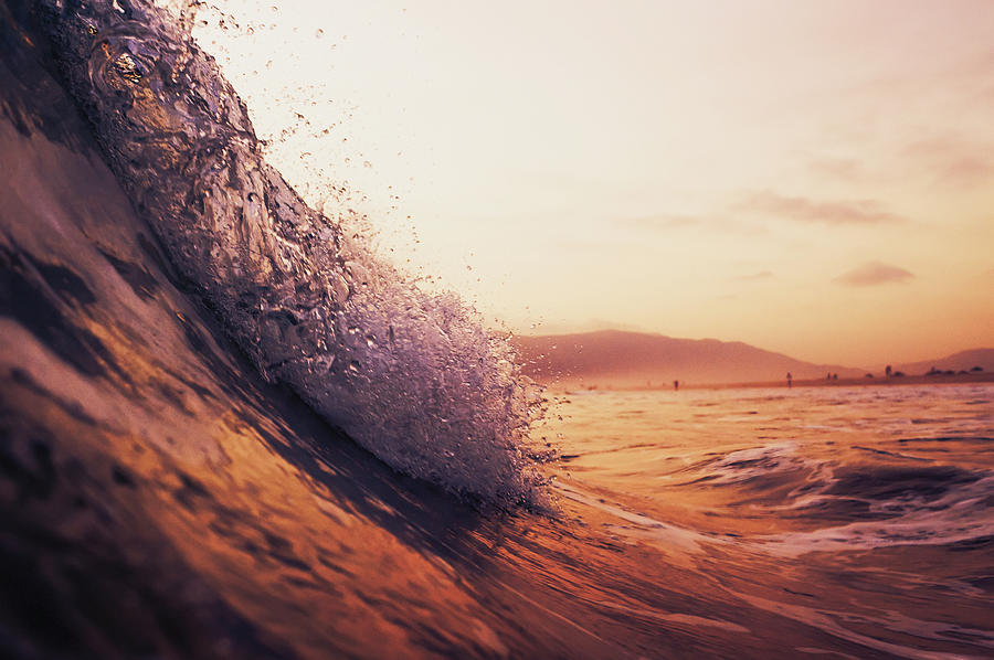 A Large Wave In The Ocean At Sunset Photograph by Ben Welsh / Design Pics