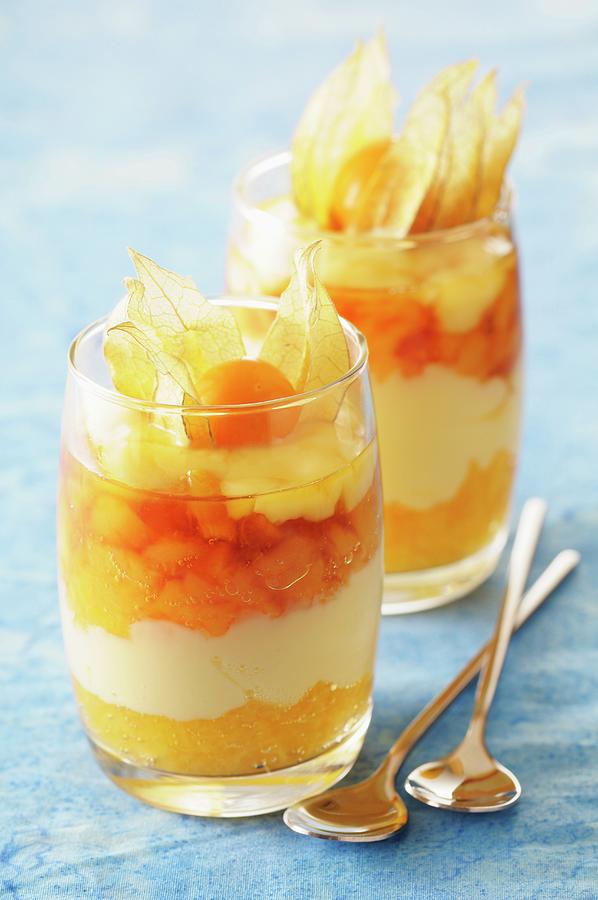 A Layered Dessert With Apricots, Caramel Mousse And Physalis Photograph by Riou, Jean-christophe