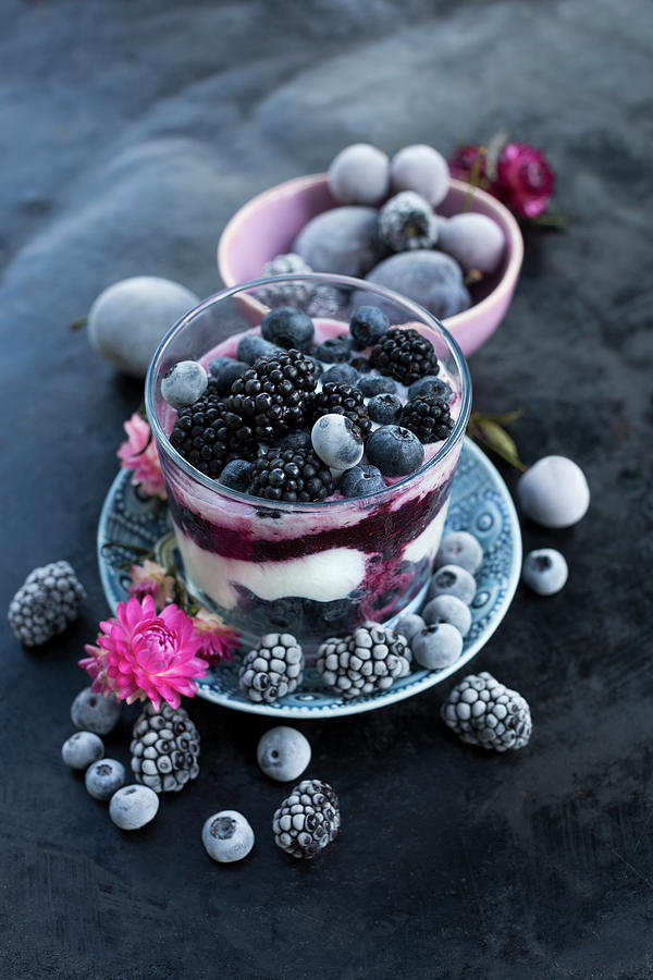 A Layered Dessert With Fresh Yoghurt, Berry Mash, Frozen Blueberries And Blackberries Photograph by Sabine Lscher